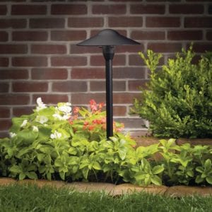 Black exterior light with green plants and red bricks green artificial/synthetic grass/turf Turf Monsters AZ