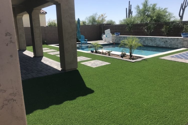 Artificial grass with pool and pavers Turf Monsters AZ