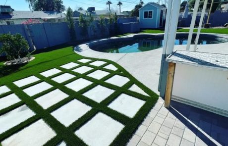 artificial turf and pool in a backyard