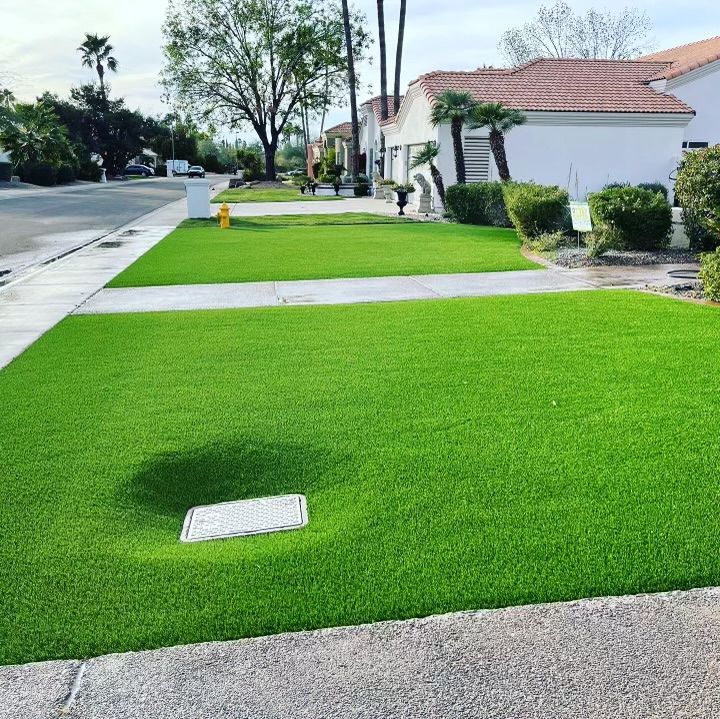 front yard with large green artificial turf lawns