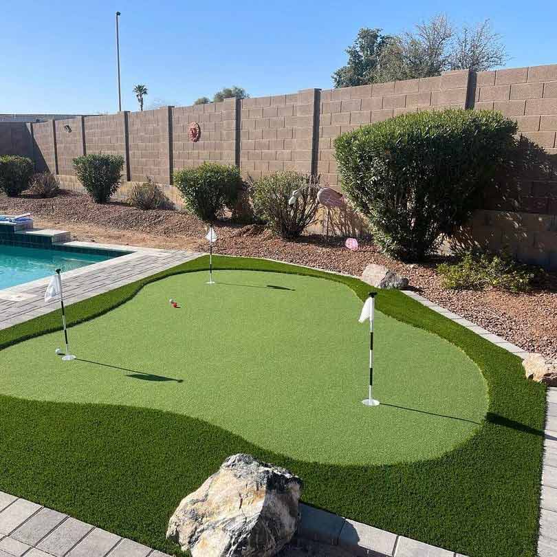 Carefree Yard with Custom-Installed Putting Gree with 3 Holes & Flags