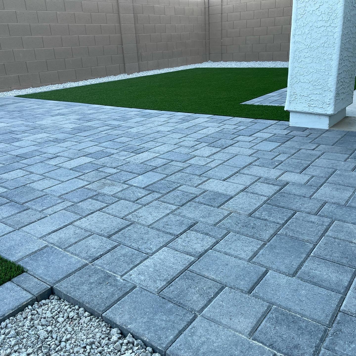 Pavers leading to patch of artificial turf
