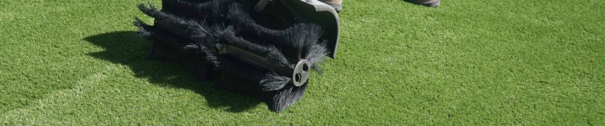 Artificial turf cleaning brush