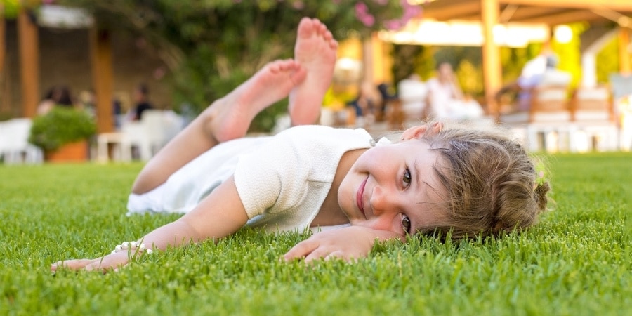 Kid Playing on Artificial Turf