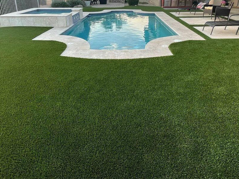 Artificial grass installed around swimming pool