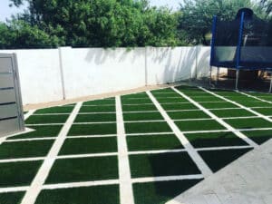 Checkered design fake grass install in Arizona