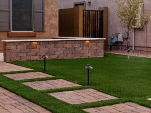 Arizona front yard with fake grass and new pavers